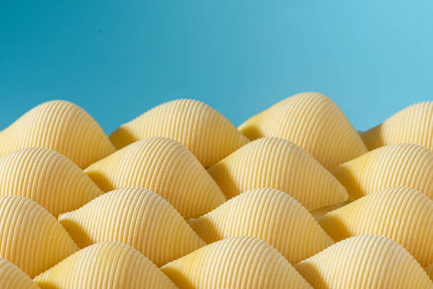 istock Pasta conchiglioni or conchiglie pattern with blue background. Abstract creative food concept 1348874242