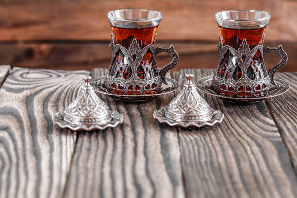 istock Fragrant Turkish tea and Turkish sweets in national dishes 1348874308