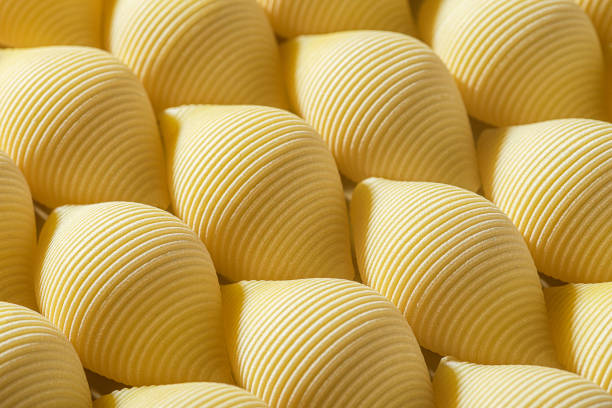 istock Pasta conchiglioni or conchiglie pattern. Abstract creative food background 1348874348