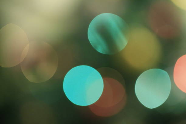 Glitter sparkling abstract bokeh defocused background, celebration. Tinsel on the background of a sparkling Christmas tree. Festive new year background. Abstract natural background. stock photo