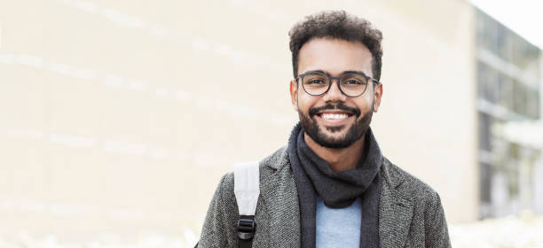 istock Handsome young man wearing warm clothing looking at camera, banner 1348874757