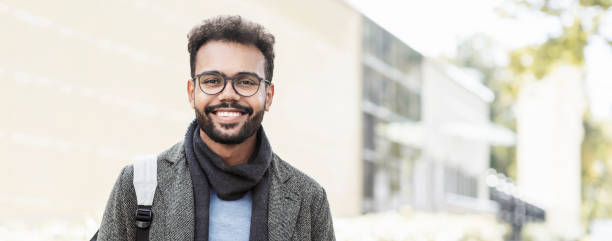 istock Handsome young man wearing warm clothing looking at camera, banner 1348874779