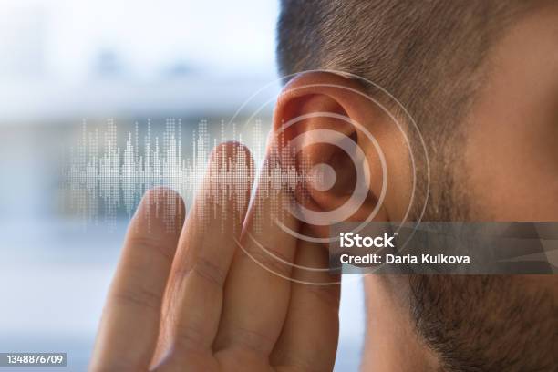 Young Man With Hearing Problems Or Hearing Loss Hearing Test Concept Stock Photo - Download Image Now