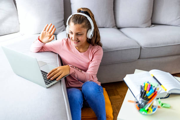 istock Gen-Z woman studying at home during covid-19 quarantine 1348882251