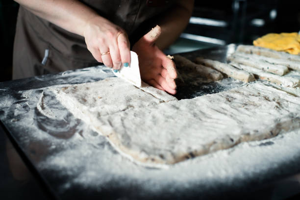 istock Molding rye sticks with chocolate and hazelnuts by a woman 1348884247