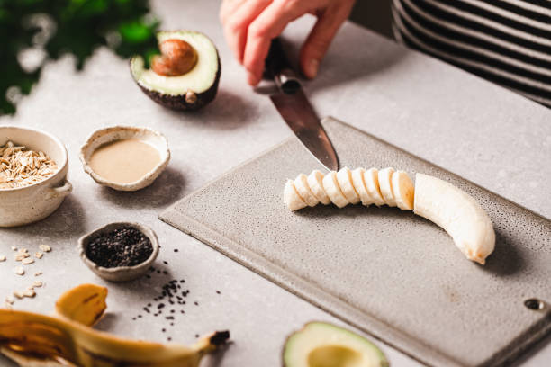 istock Chopped banana with other ingredients for making smoothie bowl 1348884374