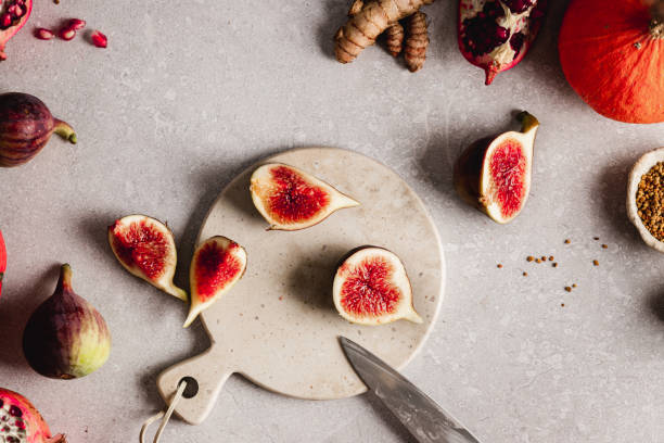 Chopped figs on a cutting board over kitchen counter