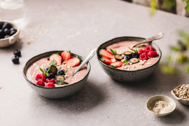 istock Two strawberry smoothie bowls on kitchen counter 1348886232