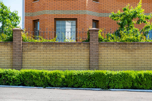 istock Decorative brick fence in front of the house 1348886746