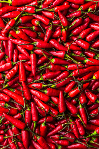 istock Hot Chili Peppers Background. Chilli Texture Closeup View 1348893737