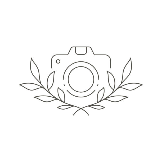 elegantní jednoduchá kamera s botanickým dekorem větve stromu pro umělecký koníček nebo pracovní povolání logo vektor - kadeřnictví fotky stock ilustrace