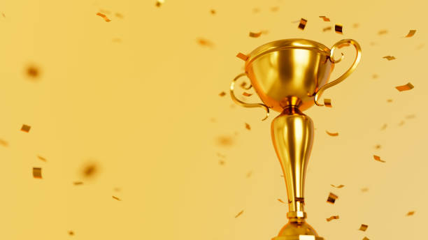 istock Golden winner cup and confetti 1348897732