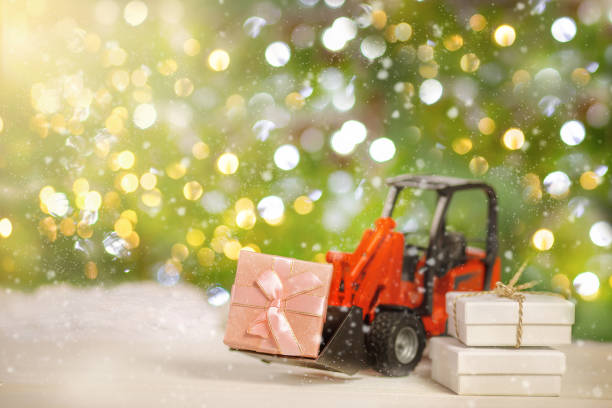 istock Tractor transports boxes with gifts 1348898835
