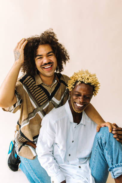 istock Ethnic gay couple smiling cheerfully 1348903211