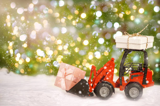 Tractor is carrying Christmas gifts.