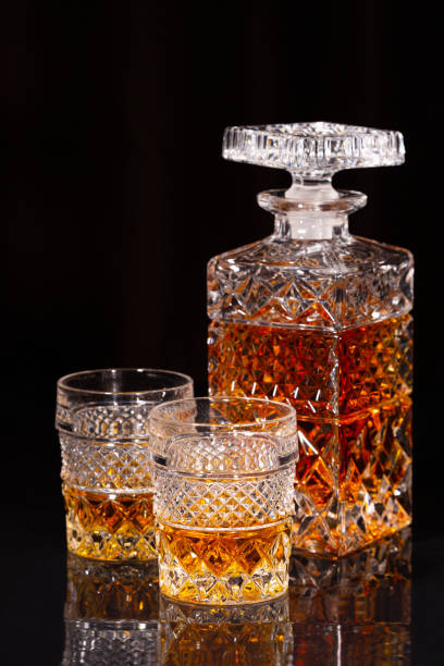 istock Crystal decanter and two glasses of alcoholic drink 1348904954