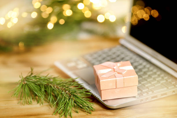 istock Christmas gift box on a laptop 1348905719