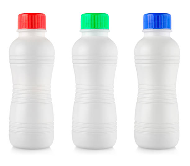 istock Opaque white plastic bottles with colored lidon white background 1348906283