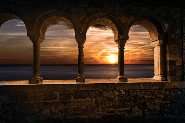 Beautiful sunset over the Sea from the Church of San Pietro - Porto Venere, Cinque Terre, Italy Portovenere or Porto Venere. Beautiful sunset over the Sea, view from the porch of the medieval Church of San Pietro (St. Peter, 1198), UNESCO world heritage site. La Spezia, Liguria, Italy, Europe. church of san pietro photos stock pictures, royalty-free photos & images