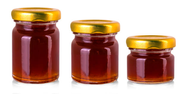 istock small glass jars with jam isolated on white 1348906347
