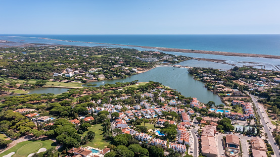 Aerial overview of luxury villas located around Quinta do Lago, Algarve, Portugal, Europe. Drone shot in the green zone. High quality photo