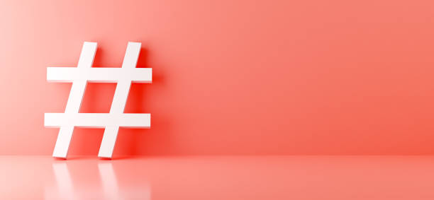 istock White hashtag symbol on light pink background. Social media metadata tag concept in 3D render 1348913189