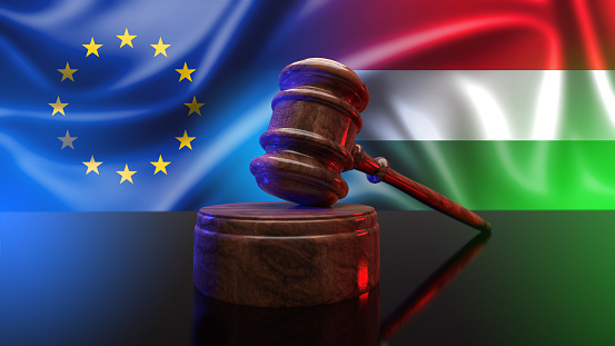 Gavel on the background flags Hungary and EU.