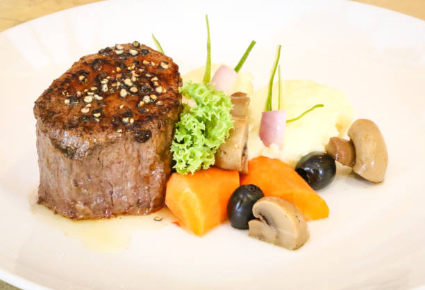 istock Tenderloin steak served with mashed potatoes and sauteed vegetables 1348918263