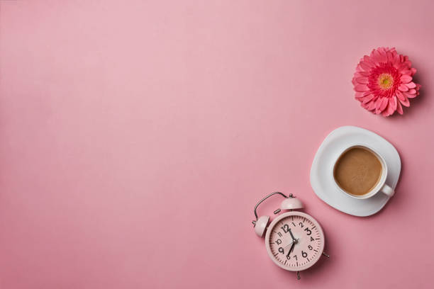 istock Alarm clock and a single flower 1348918272