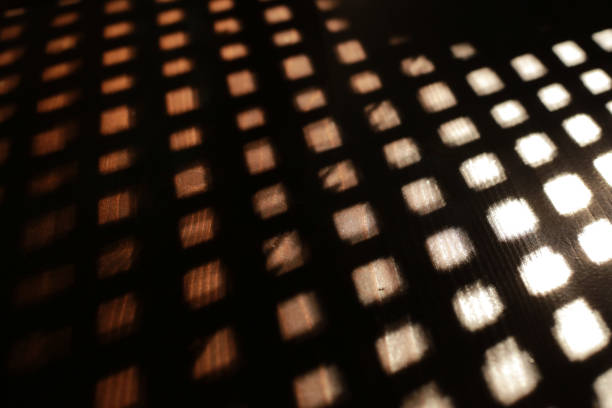 istock Textured geometric play of light and shadow on the table for background. 1348918842