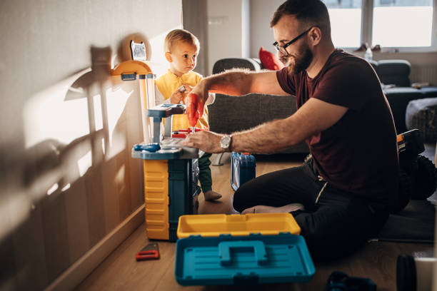 istock Father and son playing together 1348921187