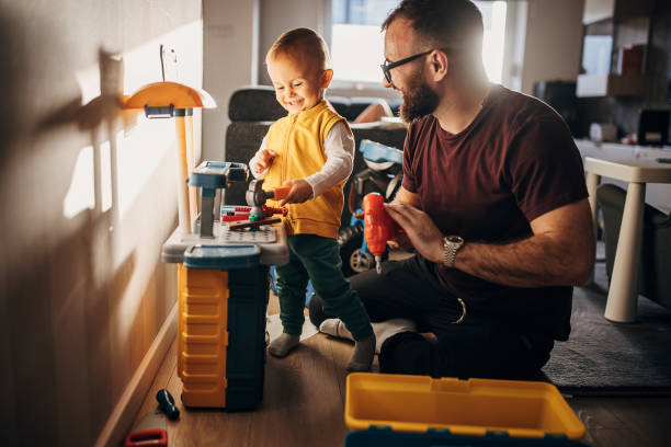 istock Father and son playing at home 1348922288