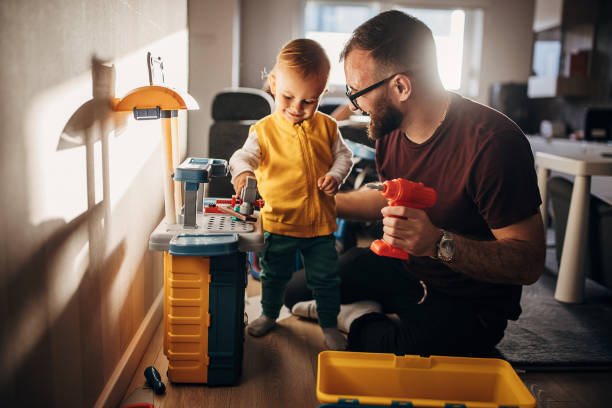 istock Father and son playing at home 1348922299