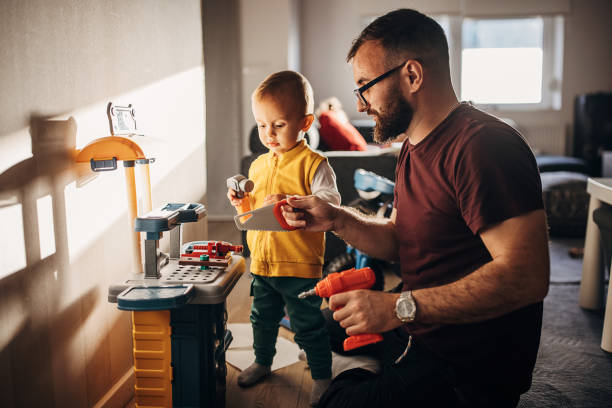 istock Father and son playing at home 1348922824