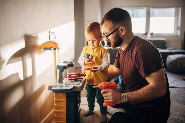 istock Father and son playing at home 1348925099