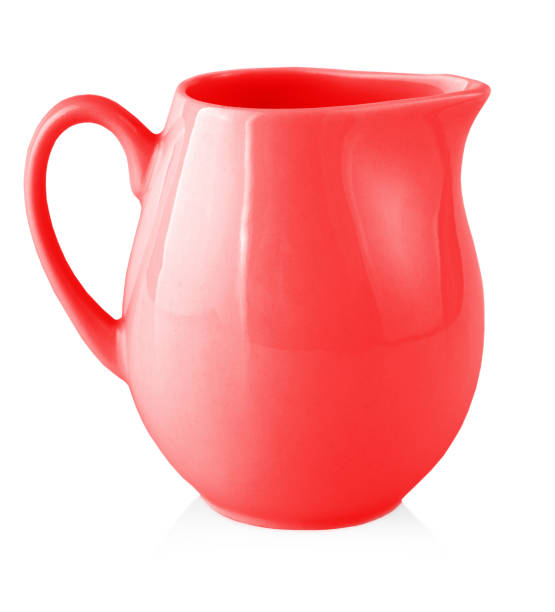 istock Red milk jug for milk on a white background. Copy space 1348926304