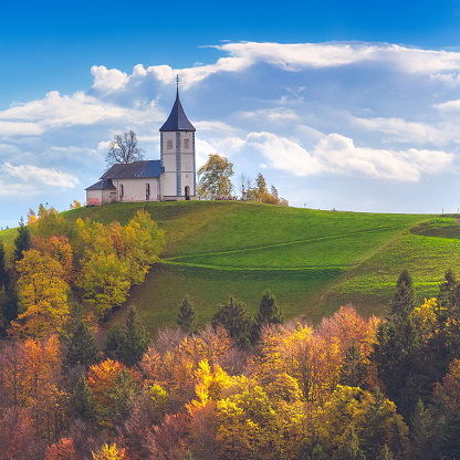 Autumn panorama with Saints Primus and Felician Church on top of hill in Slovenian countryside