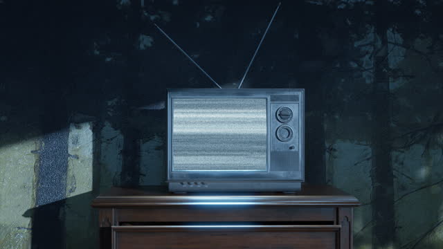 haunted room with an old television with bright static screen