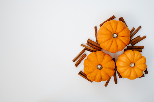 three pumpkins with cinnamon