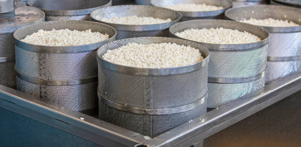 istock Making delicious cheese at a cheese factory. Selective focus 1348934301