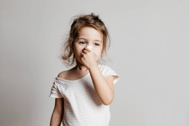 istock Little Girl Cleaning Her Nose 1348936006