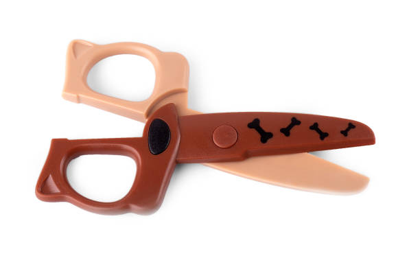 istock close up children's brown scissors isolated on white background 1348936252