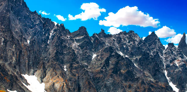 istock steep snowy peak on a beautiful sunny day on Kamchatka peninsula 1348936275