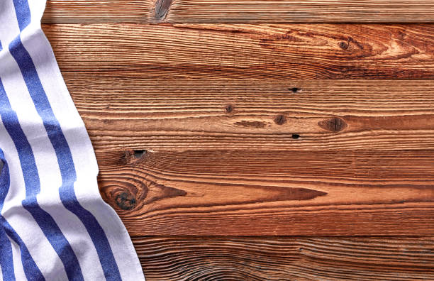 istock Wooden background with kitchen towel 1348937779