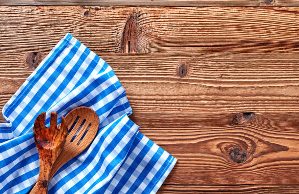 istock Wooden fork and spoon on kitchen towel 1348937790