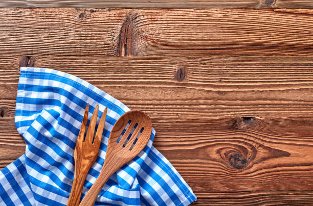 istock Wooden fork and spoon on kitchen towel 1348937811