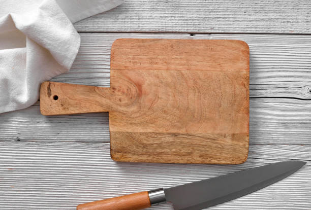 istock Wooden cutting board and kitchen knife 1348937814