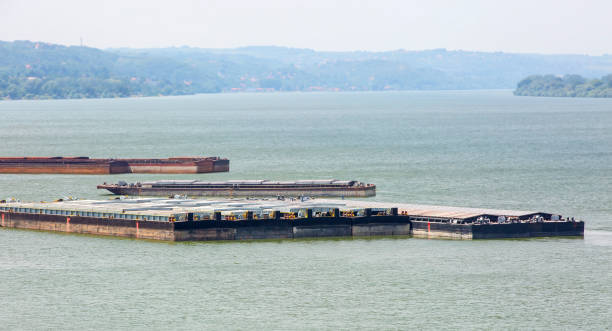 istock barge transports cargo on the river. Selective focus 1348937983