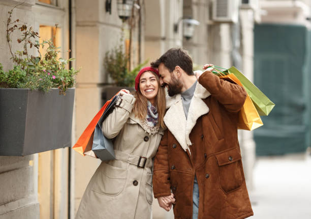 istock Lovely couple walking and shopping. 1348938272