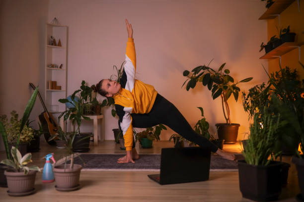istock Trikosana pose in yoga 1348938474